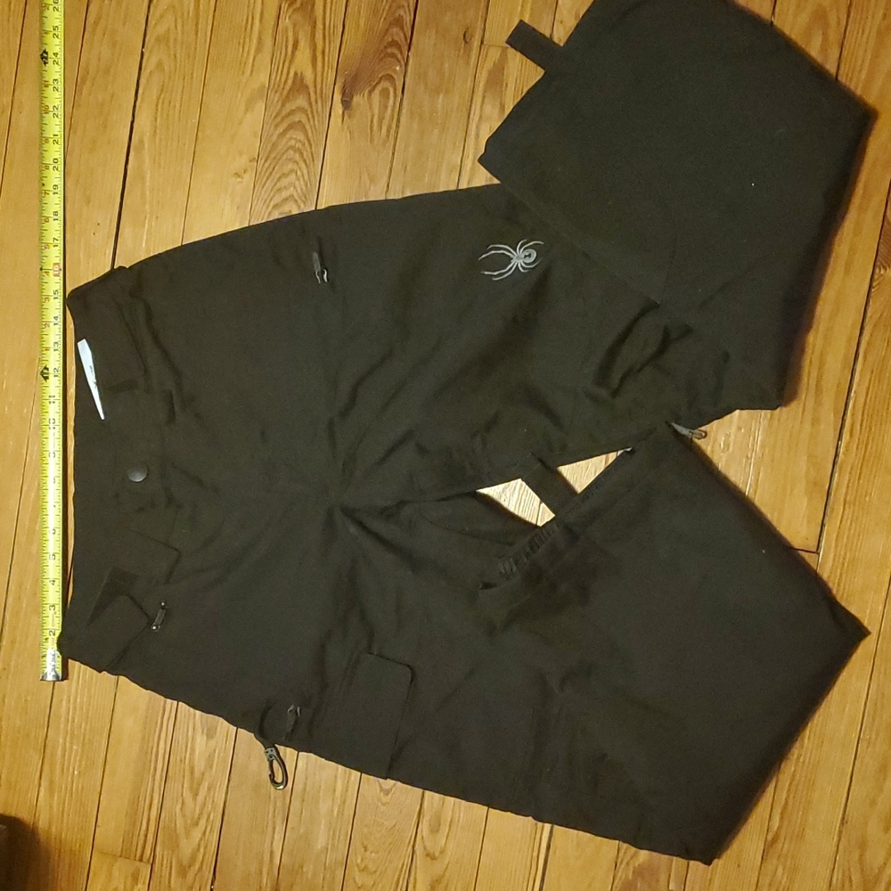 Spyder bottoms, S/P, 2 hip pockets w/ zip, 1 side pocket w/snaps, zip leg vents.